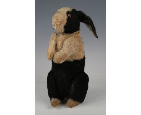 A Steiff mohair black and white rabbit, possibly Hollander Hase (Dutch Rabbit), with underscore button in left ear, pink eyes