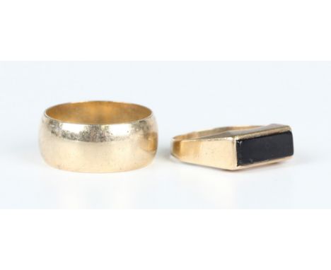 A 9ct gold wide band wedding ring, London 1982, ring size approx R1/2, and a 9ct gold and black onyx rectangular signet ring,
