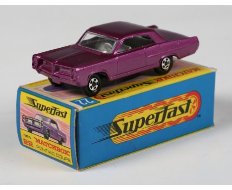 A Matchbox Superfast No. 22 Pontiac GP sports coupé in metallic purple with light grey interior and black base, boxed (one en