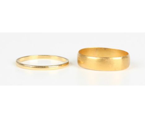 A 22ct gold wedding ring, Birmingham 1909, weight 3.7g, ring size approx T, and another gold wedding ring, detailed '18ct Ape