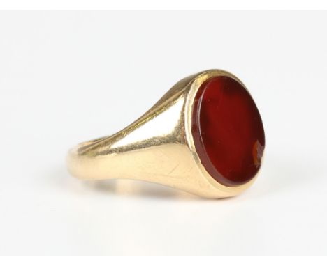 An 18ct gold and cornelian oval signet ring, London 1962, weight 9.7g, ring size approx Q1/2.Buyer’s Premium 29.4% (including