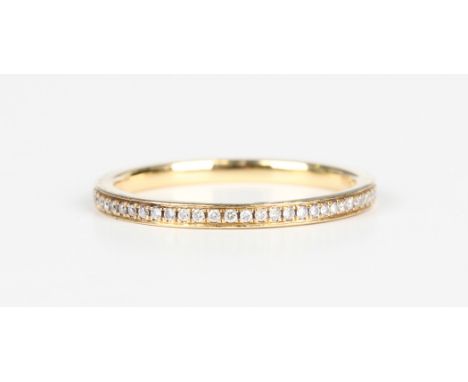A gold and diamond full eternity ring, mounted with circular cut diamonds, detailed '750', weight 1.8g, ring size approx N1/2