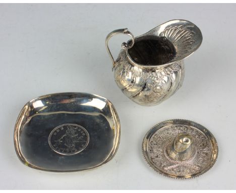 A Continental .800 silver cream jug, height 7.1cm, together with a small collection of other silver and plated items.Buyer’s 