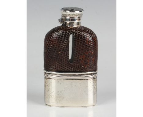 A sterling and lizard skin mounted glass hip flask with screw hinged lid and detachable cup, weight of cup 38.2g, height 10.7