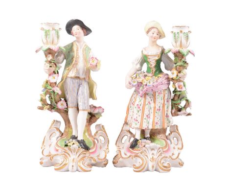 Pair of Derby porcelain candlestick figures, modelled as gardeners in 18th Century dress, painted in colours, slight damage, 