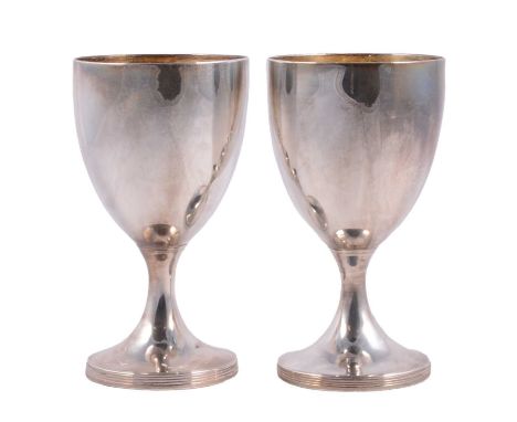 A pair of silver communion goblets, Walter Brind, London 1793, gilt interior, ridged circular foot, 16cm height, total weight