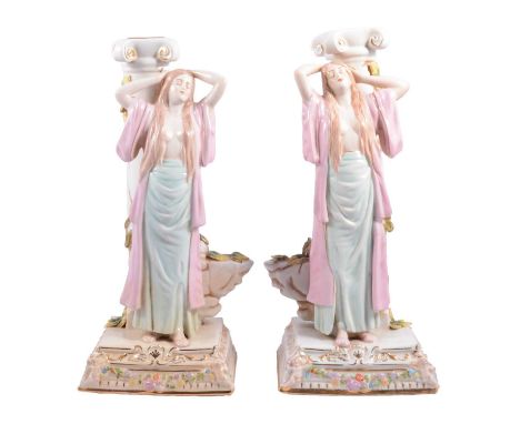 Pair of German Art Nouveau porcelain figural candlesticks, modelled as female bathers stood aside a classic column, Dresden-s