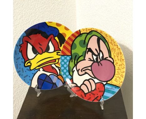 Romero Britto - Donald &amp; GrumpySet of 2 ceramic decorative plates designed by Britto. Good condition, diam. 21 cm (each).