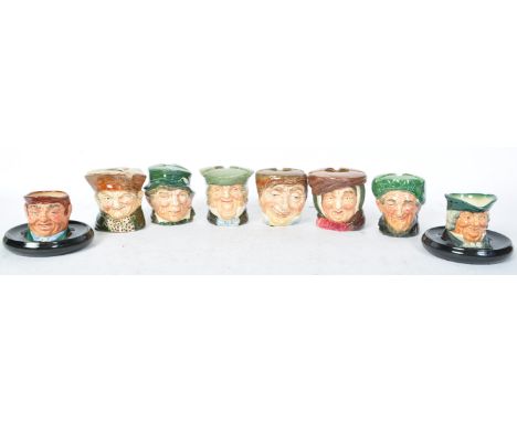 A collection of eight vintage 20th century ceramic Royal Doulton toby jugs ashtrays &amp; match sticks holders. To include Ol