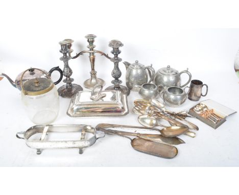 A collection of early 20th century silver plate comprising of teapot, serving tureen, flatware, candlesticks and kore, also a