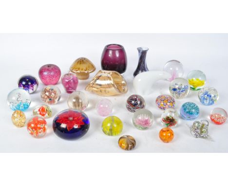 A large collection of vintage art glass 20th century paperweights with some early 20th century examples to include Wedgwood, 