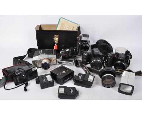 A collection of vintage 20th century photographic &amp; video cameras and flashes to include a Fujifilm FinePix S6500 digital