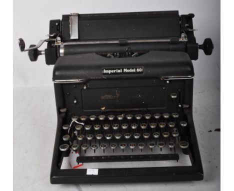 A vintage 20th Century Imperial model 60 typewriter. Of typical form, ebonised body and keys with gilt letters and numbers. W