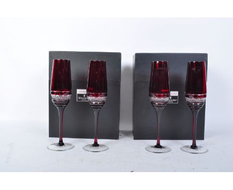 A set of four contemporary John Rocha for Waterford Crystal Red Voya ruby crystal flute glasses having hobnail decoration rai