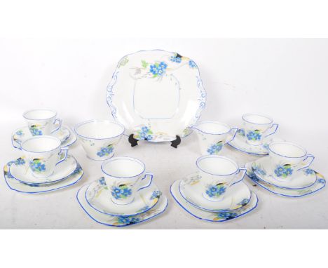 An early 20th century circa. 1920's Art Deco Sutherland bone china tea service comprising of teacups, saucers, side plates (t