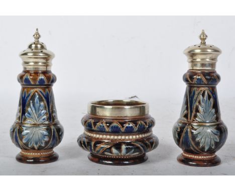 A 19th century Victorian Doulton Lambeth ceramic pottery cruet set having a pepperette and shaker with sugar bowl. The set ha