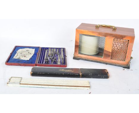 A mid 20th century vintage barometer held within a copper plate case, together with a G. C. S. engineers draughtsman's toolki