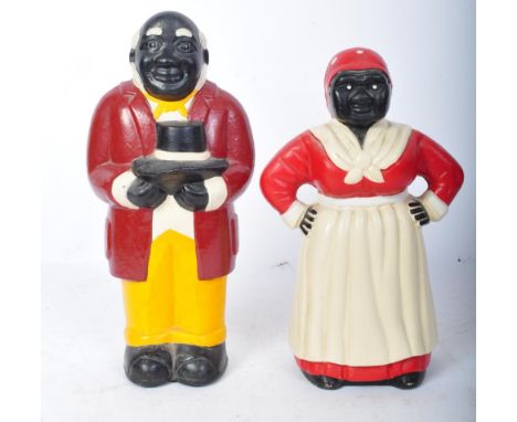 Vintage 20th Century African American cast iron money boxes / coin banks. Of human form painted red, white and yellow, Aunt J