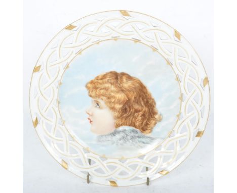 An early 20th century hand painted porcelain ribbon plate having a central hand painted portrait of an angel in profile amids