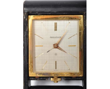 Jaeger Lecoultre - A vintage circa. 1960's Jaeger-LeCoultre gilt metal travel alarm clock held within a black leather roll ba