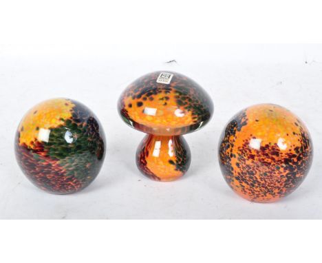 A collection of three vintage 20th century Mdina glass paperweights to include two paperweights of globular form and another 