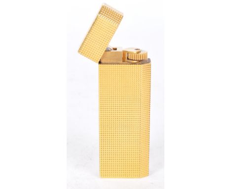 Cartier - A vintage 22ct plated Cartier cigarette lighter. The lighter having engine turned decoration to body and lid with i