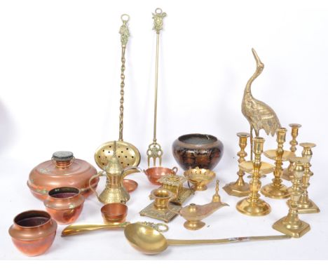 An assortment of early 20th century and later brass and copper items to include a large pelican figure, oil lamp base, firesi