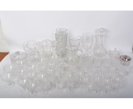 A large collection of vintage 20th century cut glass comprising of wine glasses, vases, tumblers and more.