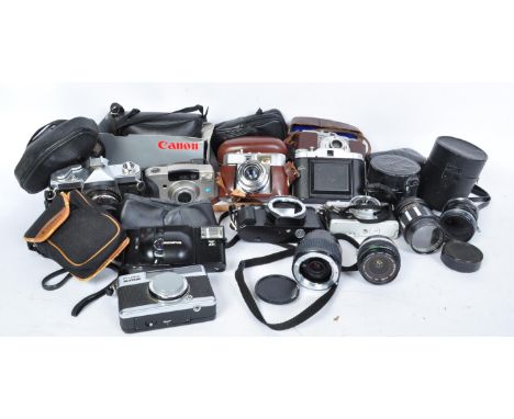 A collection of vintage 20th century photographic cameras and lenses to include a Kowa SeT camera body with Kowa Co. No. 4209