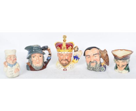 A collection of vintage 20th century ceramic Royal Doulton toby jugs. The lot to include Rip Van Winkle D6463, Merlin D6536, 