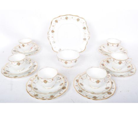 An early 20th century Royal Albert bone china tea service to comprise of six teacups, saucers, side plates (trios), cake plat