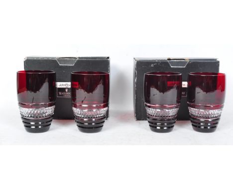 A set of four contemporary John Rocha for Waterford Crystal Red Voya ruby crystal wine glasses having hobnail decoration rais
