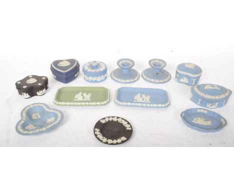 An assortment of vintage 20th century Wedgwood Jasperware items to include a series of lidded pots, dishes, and a candlestick