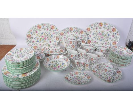 A vintage 20th century Minton Haddon Hall dinner service comprising 13 dinner plates, 17 tea plates, 11 soup plates, tea pot,