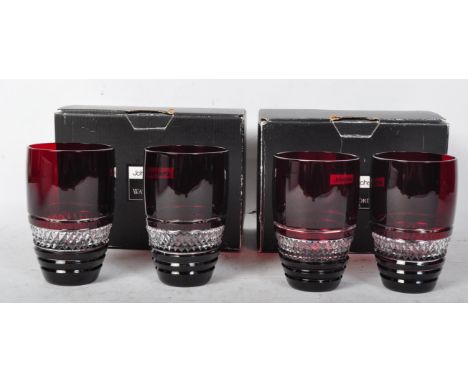 A set of four contemporary John Rocha for Waterford Crystal Red Voya ruby crystal wine glasses having hobnail decoration. Mea