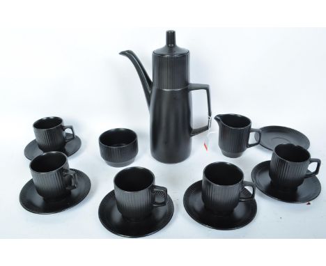 A vintage retro 20th century circa. 1960's black china coffee service comprising of six teacups, six saucers, a sugar bowl an