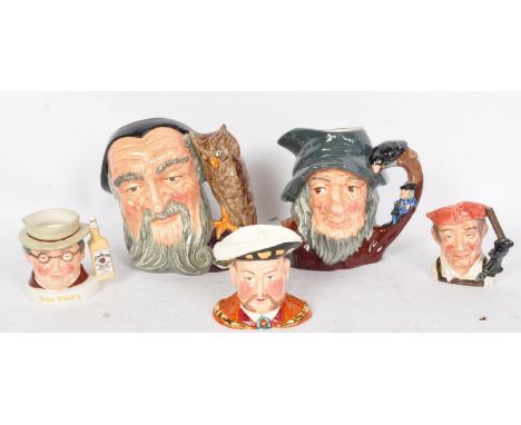 A collection of vintage 20th century ceramic Royal Doulton toby jugs. The lot to include Rip Van Winkle D6438, Merlin D6529, 