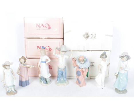 An assortment of vintage 20th century Spanish porcelain Nao figurines to include Girl with Dove, Dancing Clown, How Pretty, B