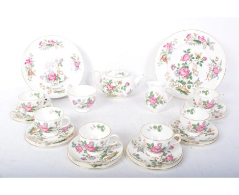 A vintage 20th century Wedgwood Charnwood six person china tea set comprising of cups, saucers, side plates, the pot with lid