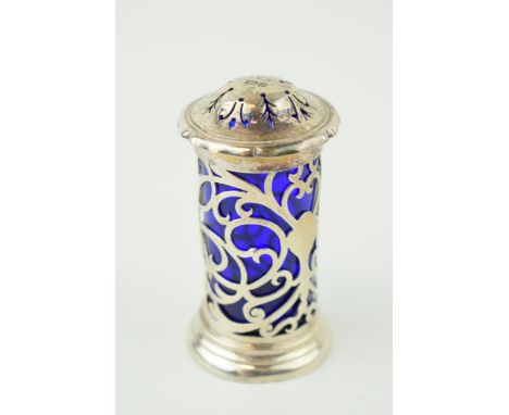 Silver ornate pepperette, Sheffield 1904, Henry Atkin, 31.9g, with blue glass liner, 7cm tall.