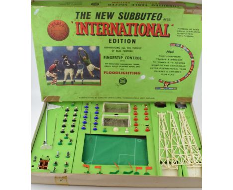 A boxed Subbuteo Table Football Game 'International Edition, c1960s.  In good condition and complete apart from one floodligh