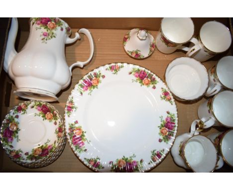 A collection of Royal Albert tea and dinner wares to include coffee pot, mugs, saucers, 10 1/2" plates, sugar and cream. (Qty