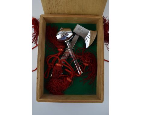 A wooden cased presentation set including an axe and a mallet, 'M V Hunan 12th June 1981, with red tassels, 31cm wide.