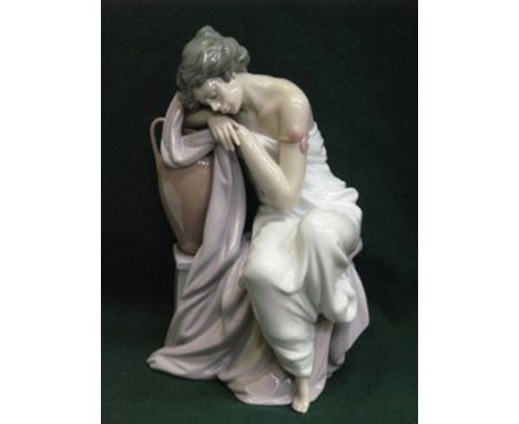 LLADRO GLAZED CERAMIC FIGURE OF A SEATED LADY, APPROXIMATELY 27cm HIGH 