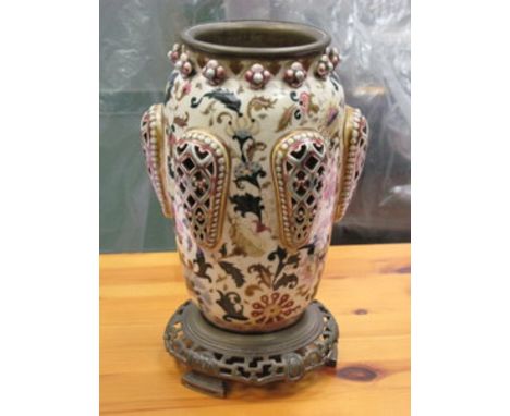 CONTINENTAL STYLE PIERCEWORK GLAZED CERAMIC VASE WITH BRASS INSERT RIM AND BRASS STAND, APPROXIMATELY 30cm HIGH 