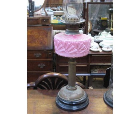 VINTAGE BRASS OIL LAMP AND PINK COLOURED GLASS RESERVOIR, APPROXIMATELY 43cm HIGH 