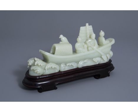 A large Chinese carved celadon jade model of a boat, 19th C. -- H 18,3 - L 33 cm (incl. stand) -- -- --  Please request condi