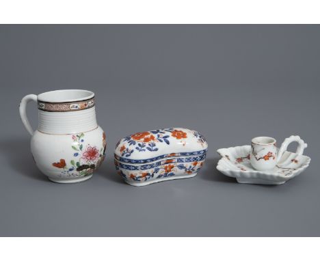 A Chinese Imari style box and cover, a famille rose mug and a candlestick, Kangxi and later -- H 10,4 cm (the mug)Ê 11,6 x 5,