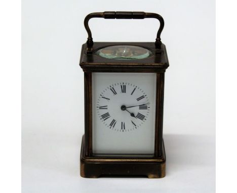 An early 20th brass, five glass carriage clock, the eight day movement faced by enamel Roman dial. 18cm ( handle up)Currently
