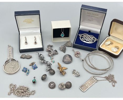 A collection of sterling silver and continental silver jewellery. To include a Les Howe sterling silver Celtic brooch; a synt